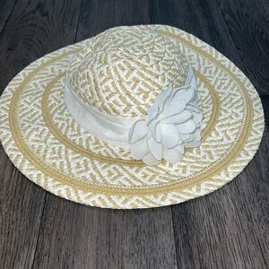 Infant stylish brim sun hat with sheer like floral sash.